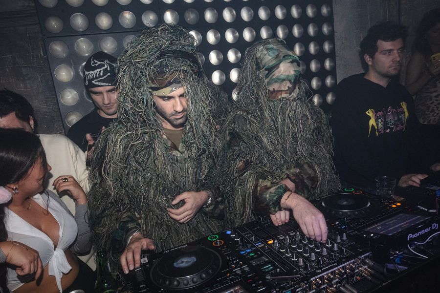 DJs in ghillie suits behind the decks
